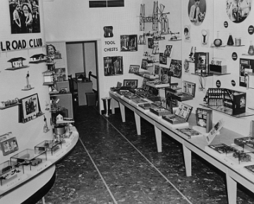 Toward the rear of the store, Erector sets were displayed on the right and train items on the left.