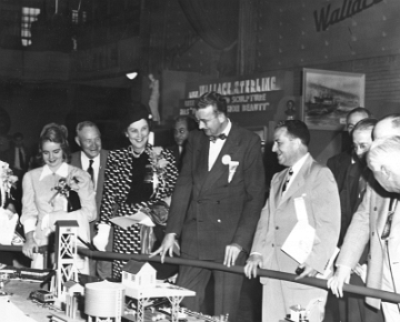 1948 Display - Governor's Day, September 20, 1948 - Left to Right Frances B. Reddick, Sec. of State, Claire Shannon, daughter of the Governor, Commissioner John J. Egan, Mrs Shannon, Governor James J. Shannon, Raymond Loring, Chairman, State Development Commission, Connecticut. The date on the back of this photo enabled the dating of all other photos in which this layout appears.