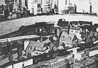 Pre-Industrial Area The industrial area at far right end of layout is looking very residential in this view. As best as I can determine, this was the earliest version of this area. The residential buildings in place were manufactured by Skyline Manufacturing Company of Philadelphia. From left to right are two No. 601 "O Gauge" suburban residences, with the second rotated 180 degrees to provide a different view. The third building appears to be a No. 605 "O Gauge" cottage residence. Although the buildings were nominally O gauge, they seem quite appropriate for S, with the No. 601 scaling out at 32x40 feet and the 605 scaling out at 36x45 feet.