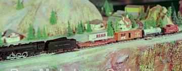 HO Hudson Set This photo may have been taken on the 200 5th Avenue layout. We can probably date this photo to 1959 or possibly 1960 as it shows the Hudson HO set offered in those years. I suspect these photos are from 1959, rather than 1960 as the collection of photos omits the C&O Alco DL-600 set offered in 1960, but not in 1959. The only photo I have seen that shows that entire 200 5th Avenue layout appears to have an elevated area for HO and that is where I think this photo might have been taken. I have not been able to identify any Gilbert advertising which uses this photo.