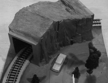 This panel and the three that follow it in the slide show seem to indicate that originally there was an attempt to create four distinct curved panels. This one featured a rather box like mountain.