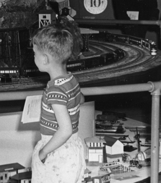This closeup of the lower right portion of the previous photo shows the Mini-craft buildings. One item visible to the right of the boy appears to be a 585 Tool Shed building. This 1952 display would be the last year that item would be displayed as it was discontinued the next year.