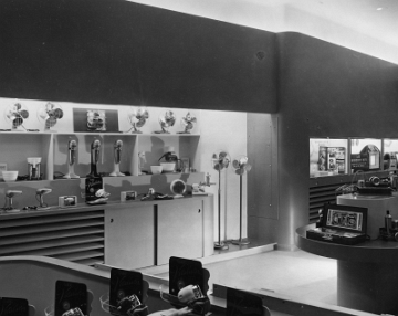 A view of the 1st floor from the Broadway side of the building. It was probably taken through the Broadway window as the displays from that window are shown in the foreground. At the far right you can see the GG1 locomotive front information desk.